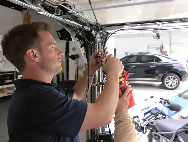 Smithfield Garage Door Repair safety certified technician performing cable replacement in Smithfield