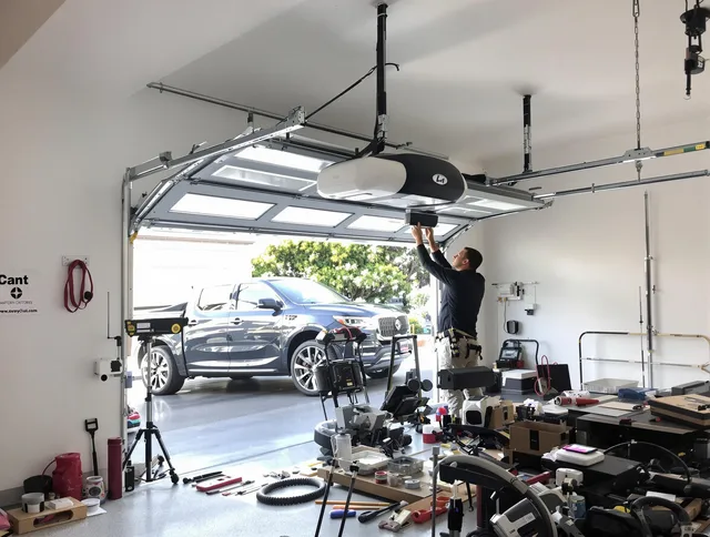 Smithfield Garage Door Repair specialist installing smart garage door opener system in Smithfield home