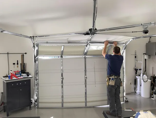 Smithfield Garage Door Repair specialist performing precise section replacement on Smithfield garage door